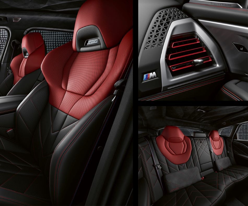 Detail of front seats, clad in exclusive BMW Individual Fiona Red & Black Merino Leather with exclusive M Signature Trim and red stitching and accents. Detail of red accented vent. Detail of rear M Lounge with exclusive XM pillows in BMW of Madison | Madison WI